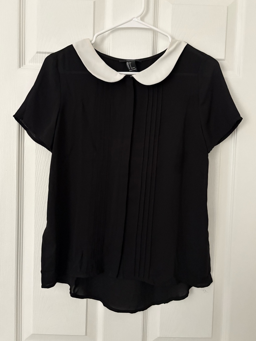 black blouse with white collar
